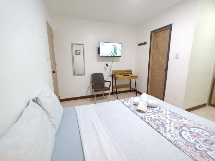 Confortable y Central Habitacion cerca a la Playa Spratt Bight y Malecon