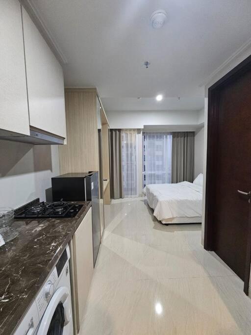 Green Sedayu Apartment Suite by Ellison