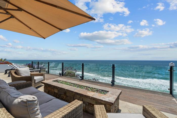 Neptune Sunset Shores Oceanfront home with expansive outdoor living, newly remodeled