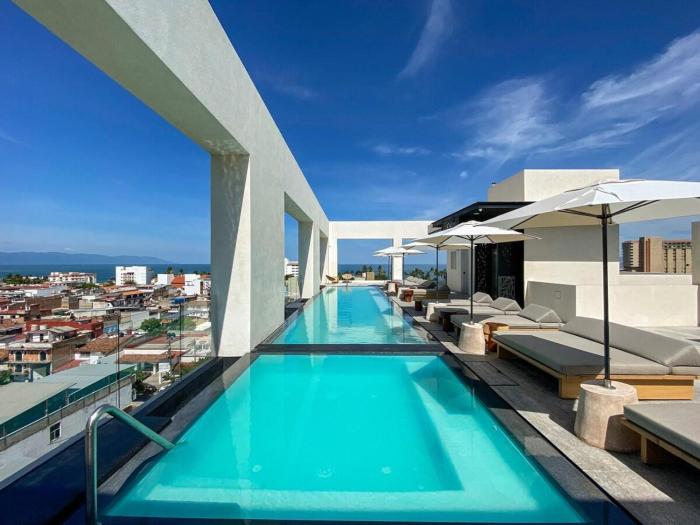 Blissful Ocean-View Penthouse with Rooftop Pool