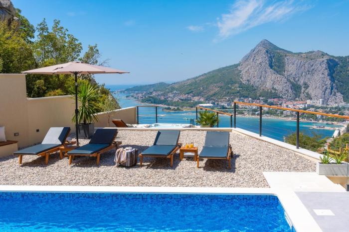 Casa Vita featuring a sea view, billiards, and heated pool