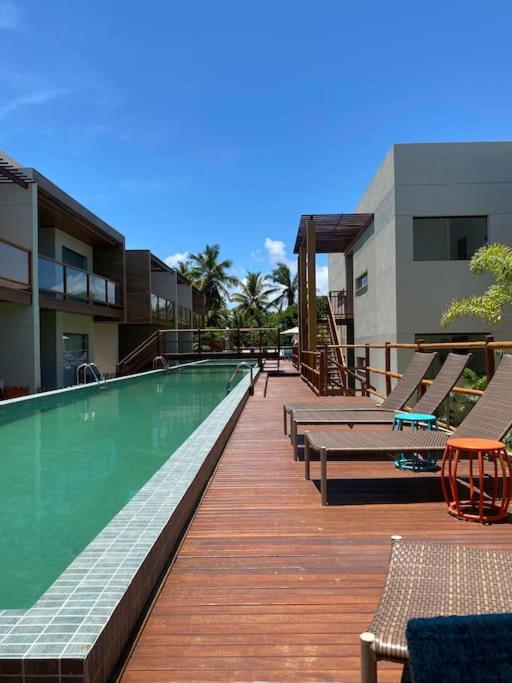 Condomínio à beira rio-mar em Imbassai