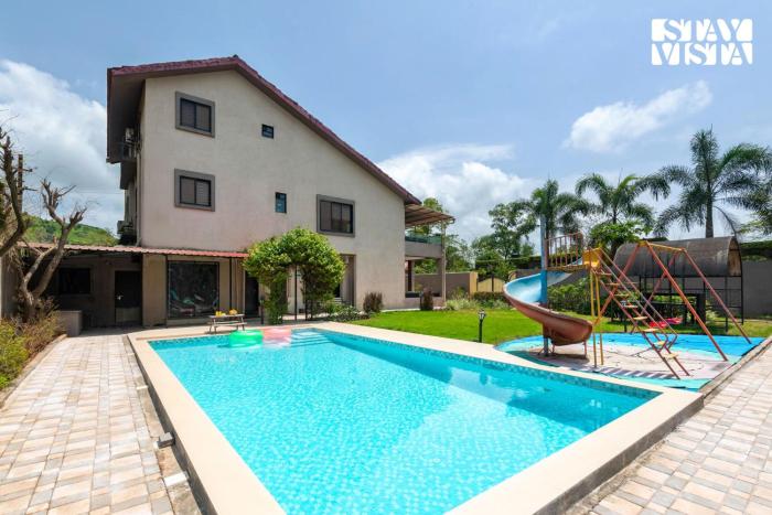 StayVista at Dusk by the Hills with Heated Pool