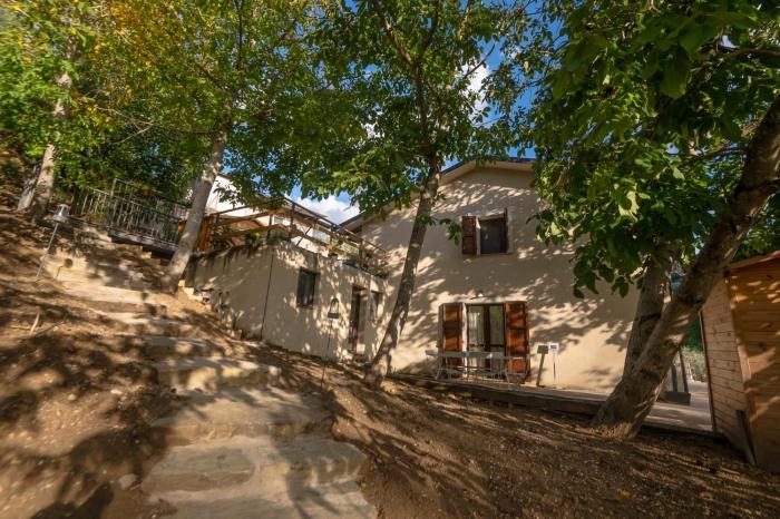 Casa sul fiume con giardino e terrazza