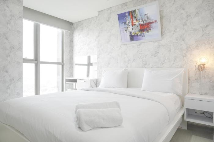 Warm and Elegant 1BR at Gold Coast Apartment By Travelio