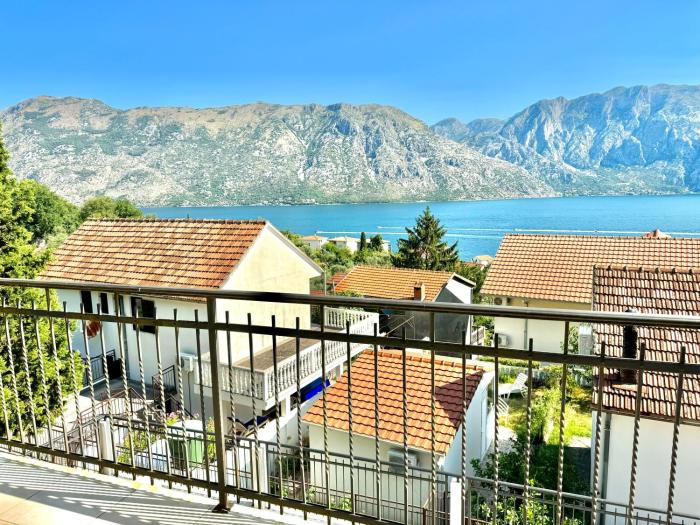 Prcanj sunny port apartments with shared pool