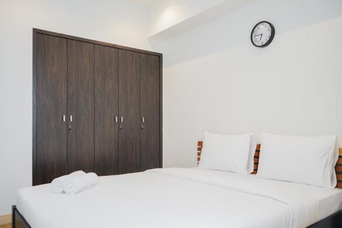 Cozy and Spacious 1BR Apartment at Branz BSD City By Travelio