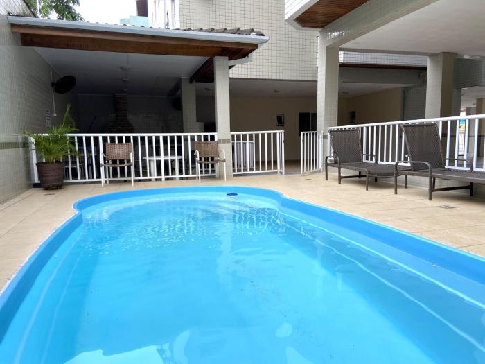 Apartamento a 100m da Praia Grande, churrasqueira, piscina e wi fi