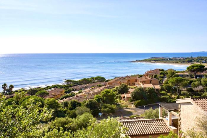 Village in Porto Corallo just 200 meters from the beach, apartments with private outdoor area
