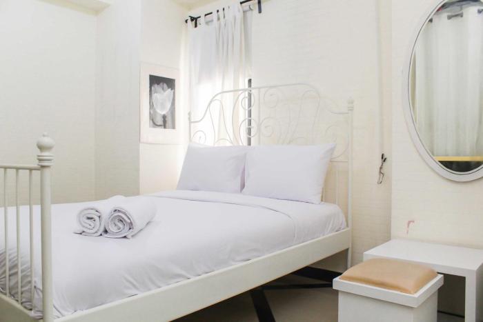 White and Nice 1BR at Bassura City Apartment By Travelio