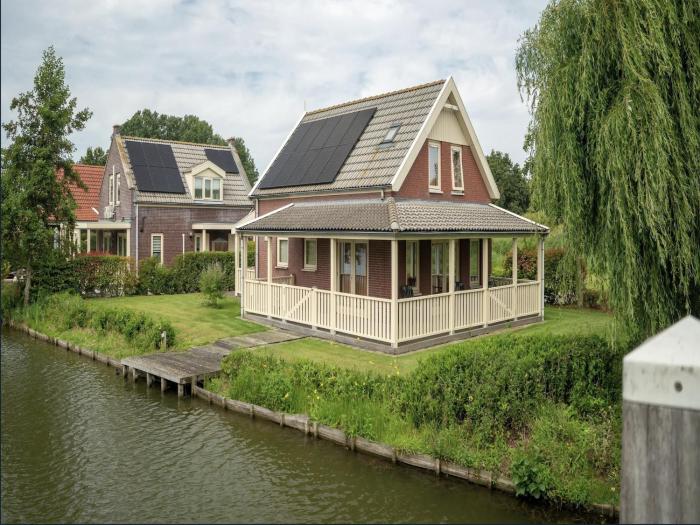 Bungalow by Water near Rotterdam with Sauna