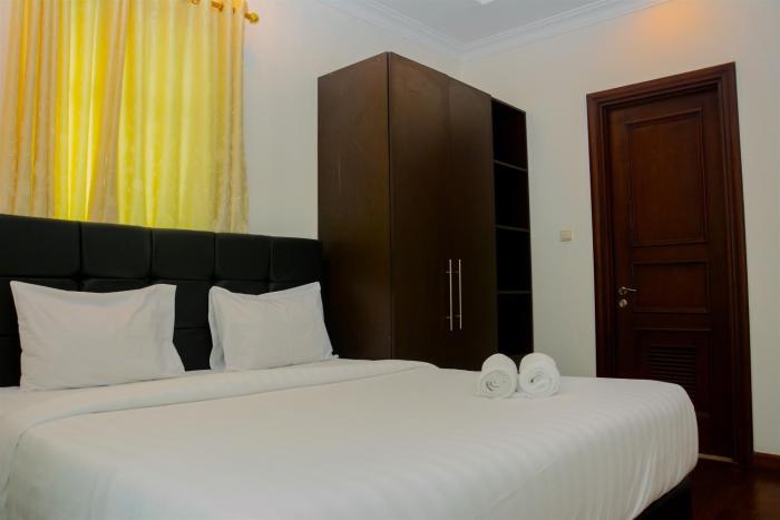 Modern 2BR at The Belleza Apartment By Travelio