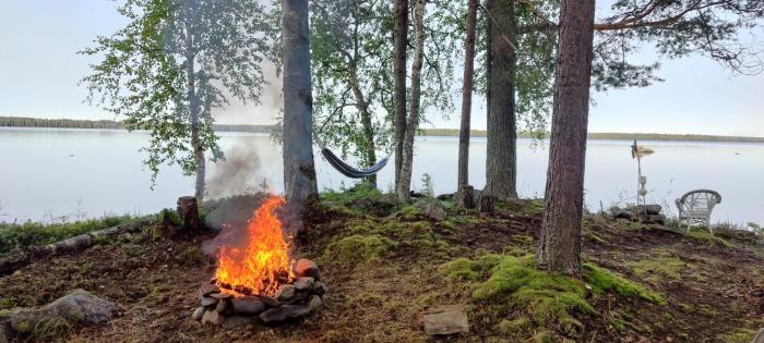 Traditional Finnish lakeside off-grid cabin