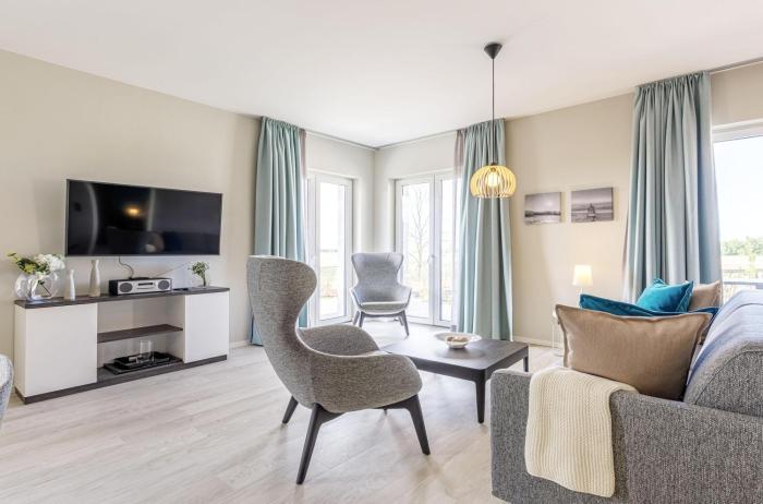 5 Sterne Ferienwohnung Boddenkieker mit großer Eckterrasse und Boddenblick