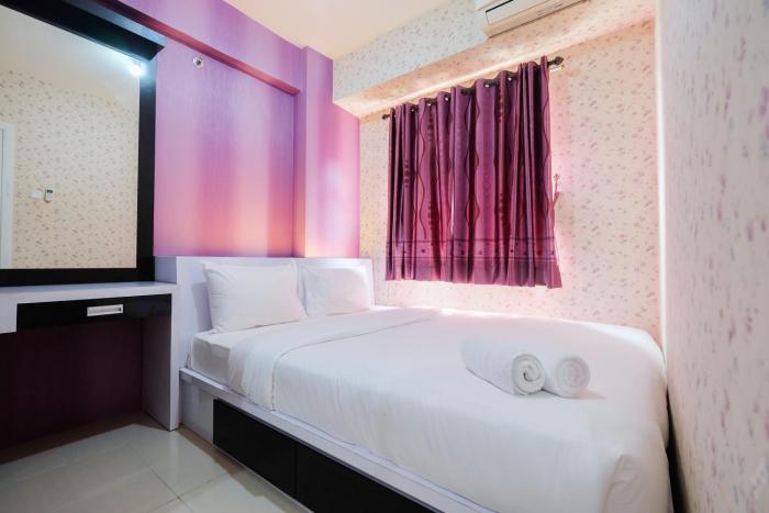 Homey 1BR with Spacious Living Room Green Pramuka City Apartment By Travelio