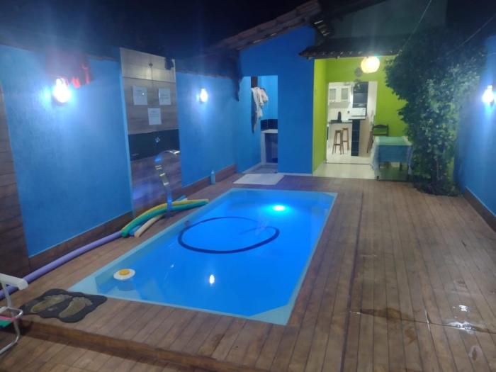 Casa com Ar e piscina no centro