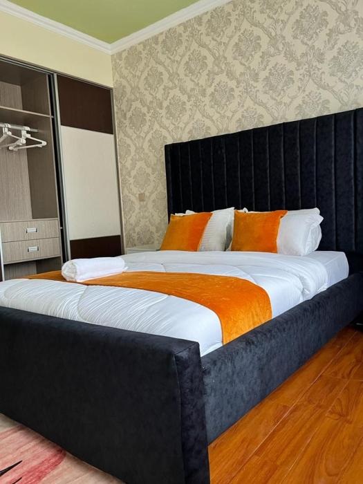 executive catchy two bedroom with heated swimming pool fully furnished gym ample parking space children playing ground and a relaxing rooftop with an amazing city views