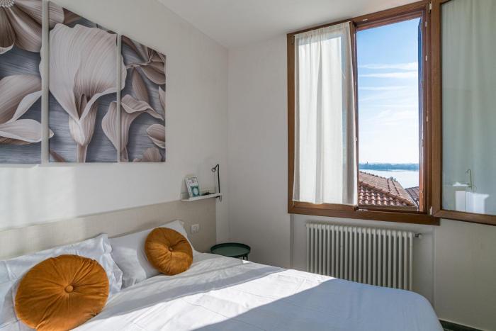 GuestHost - Spazioso apt- accesso privato al lago & posto auto