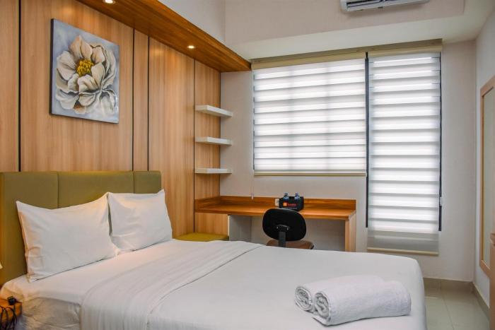 Nice and Cozy Studio at 15th Floor Evenciio Margonda Apartment By Travelio