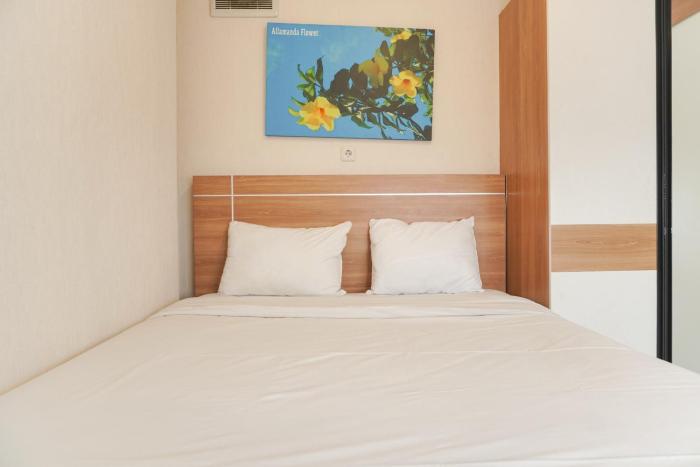 Elegant and Comfy 2BR above Mall at Bassura City Apartment By Travelio