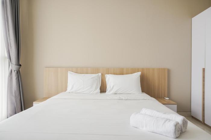 Minimalist and Comfort Living 1BR at Ciputra International Apartment By Travelio