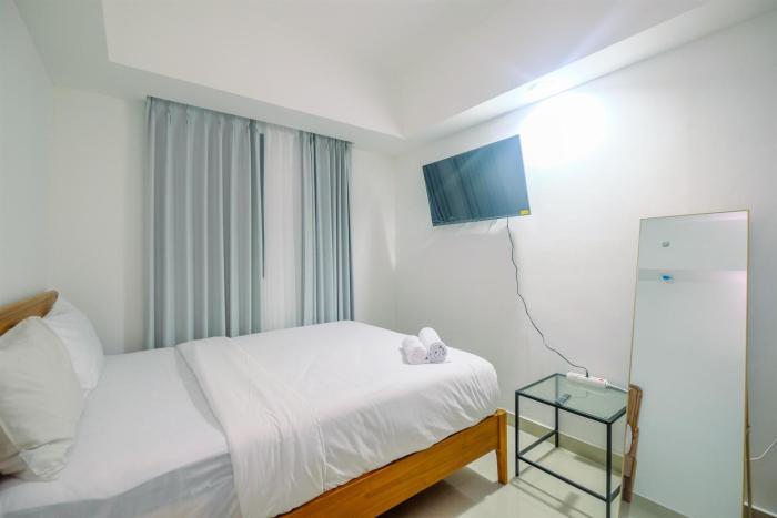 Comfort 1BR Apartment at Evenciio Margonda By Travelio