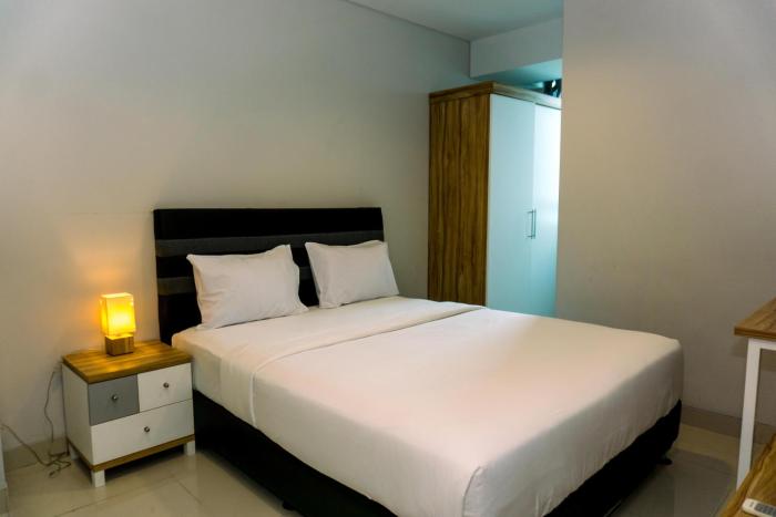 Nice and Elegant 2BR Apartment at Springhill Terrace Residence By Travelio