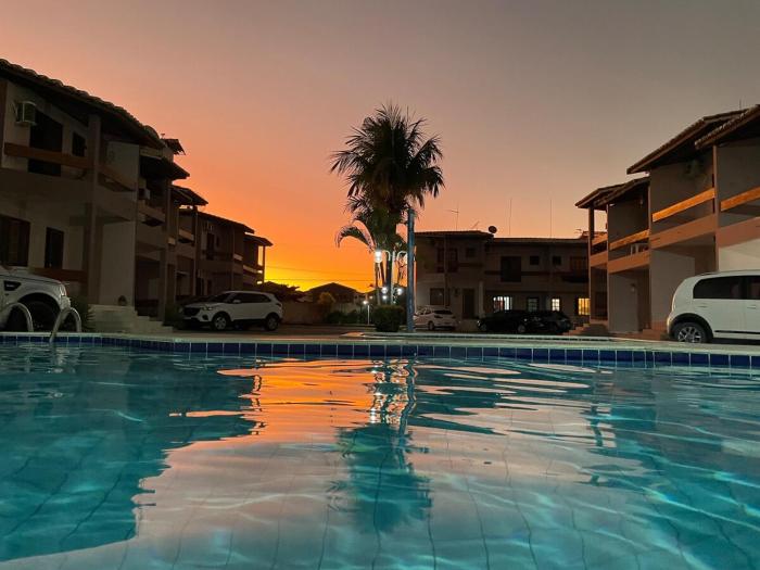 Condomínio Encantador com Piscina ao Lado da Praia