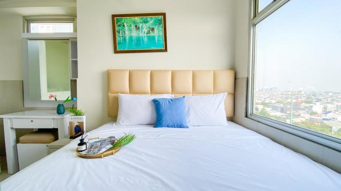 Spacious and Homey 3BR at Green Bay Pluit Apartment By Travelio