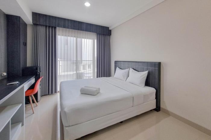 Homey and Scenic Studio at Patraland Amarta Apartment By Travelio