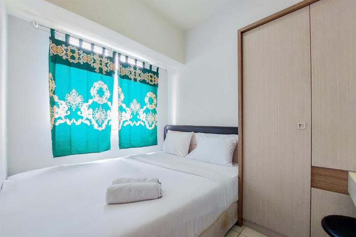 Cozy Living and Tidy 2BR Serpong Greenview Apartment By Travelio