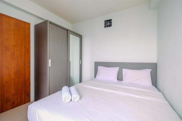 Combined 2BR with Study Room Titanium Square Apartment By Travelio