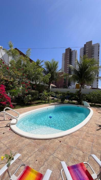 Casa na praia com jardim e piscina