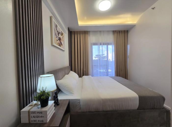 Comfy and Modernly Decorated 2 Bedroom Unit with free Parking