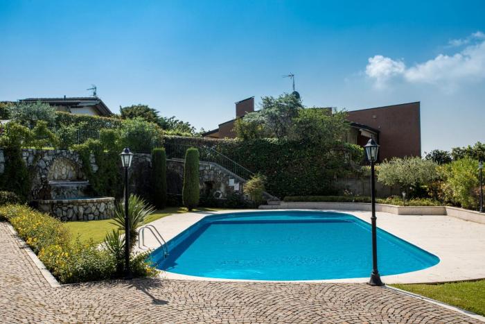 Red house with shared pool and private garden is the new black on Lake Garda