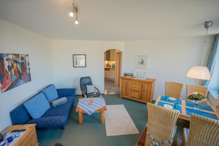 Inselblume 14 - Blaue Ferienwohnung mit Balkon am Südstrand