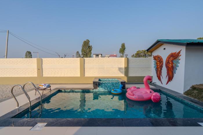 SaffronStays Sher Bagh - 4BR eco-friendly pool villa with jungle trails, farm-to-table meals & bonfire nights near Corbett Park