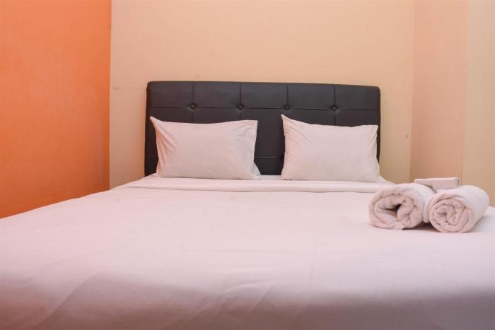 Comfort and Homey 2BR at Green Pramuka City Apartment By Travelio