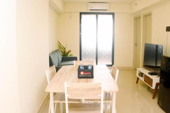 Comfort and Well Design 2BR with Working Room at Meikarta Apartment By Travelio