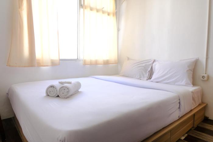 Cozy 2BR at Jarrdin Cihampelas Apartment By Travelio