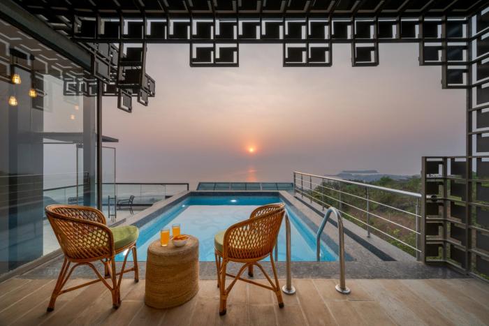 SaffronStays Nautica - 5BR hilltop villa with rooftop pool, sea views & modern interiors surrounded by greenery