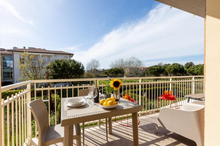 Elegant Seaside Apartment with Pool and Parking