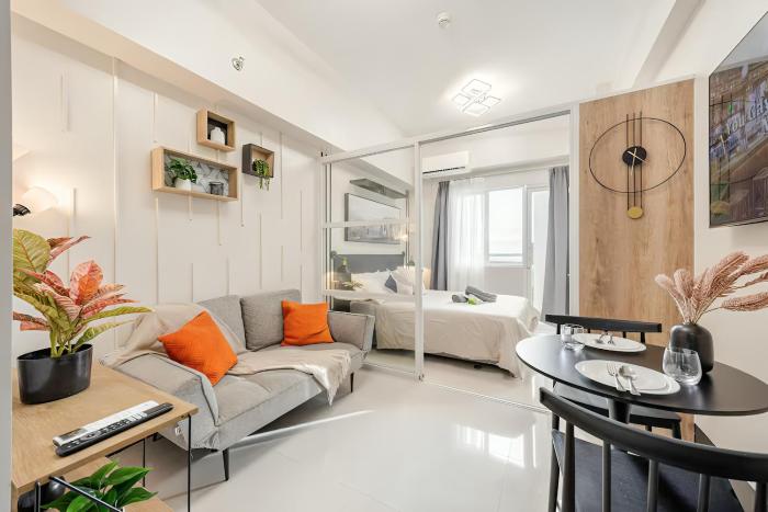 Modern Minimalist Studio with Balcony & Sunset View