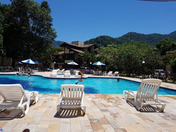Casa de condomínio com piscina em frente a praia de Maresias