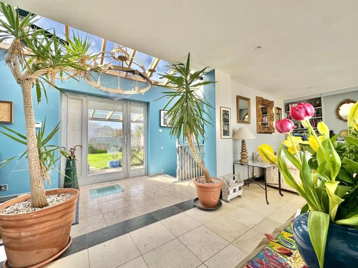 The Sandcastle. Private steps onto a sandy beach