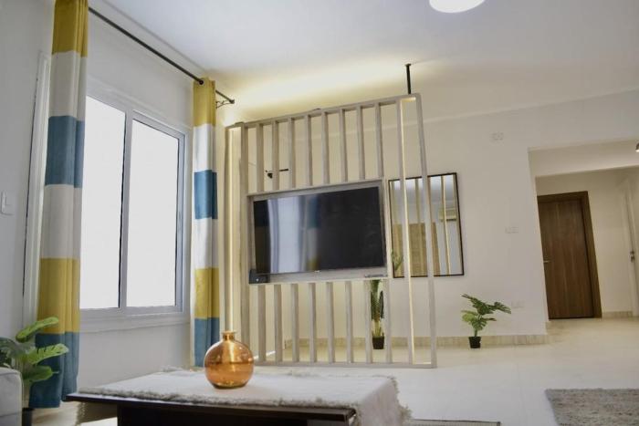 Al Motameyez Stylish 2BR Retreat with Private Garden