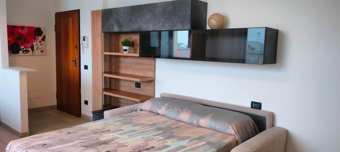 Monolocale settimo piano con garage privato Top floor studio with private garage