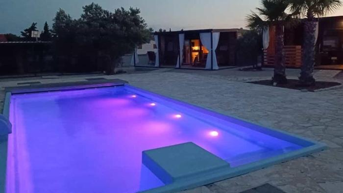 Family-friendly apartments with swimming pools Pirovac, Sibenik - 24497