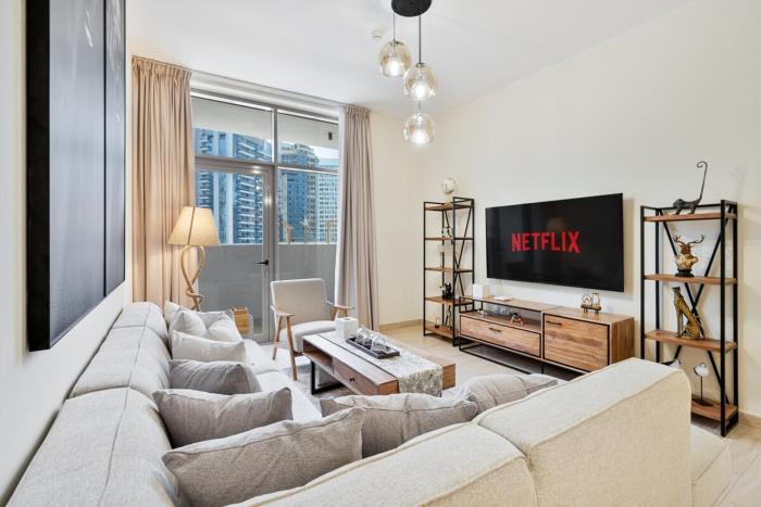 Modern 2BR with Private Terrace, Pool and Gym Access