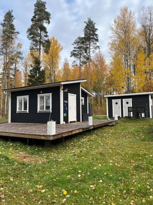 A simple stuga on a lake incinerating toilet in a separate building next to the cabin Water for drinking and washing hands dishes comes from two containers that attach to a faucet through a simple electric pump OBS no shower on site